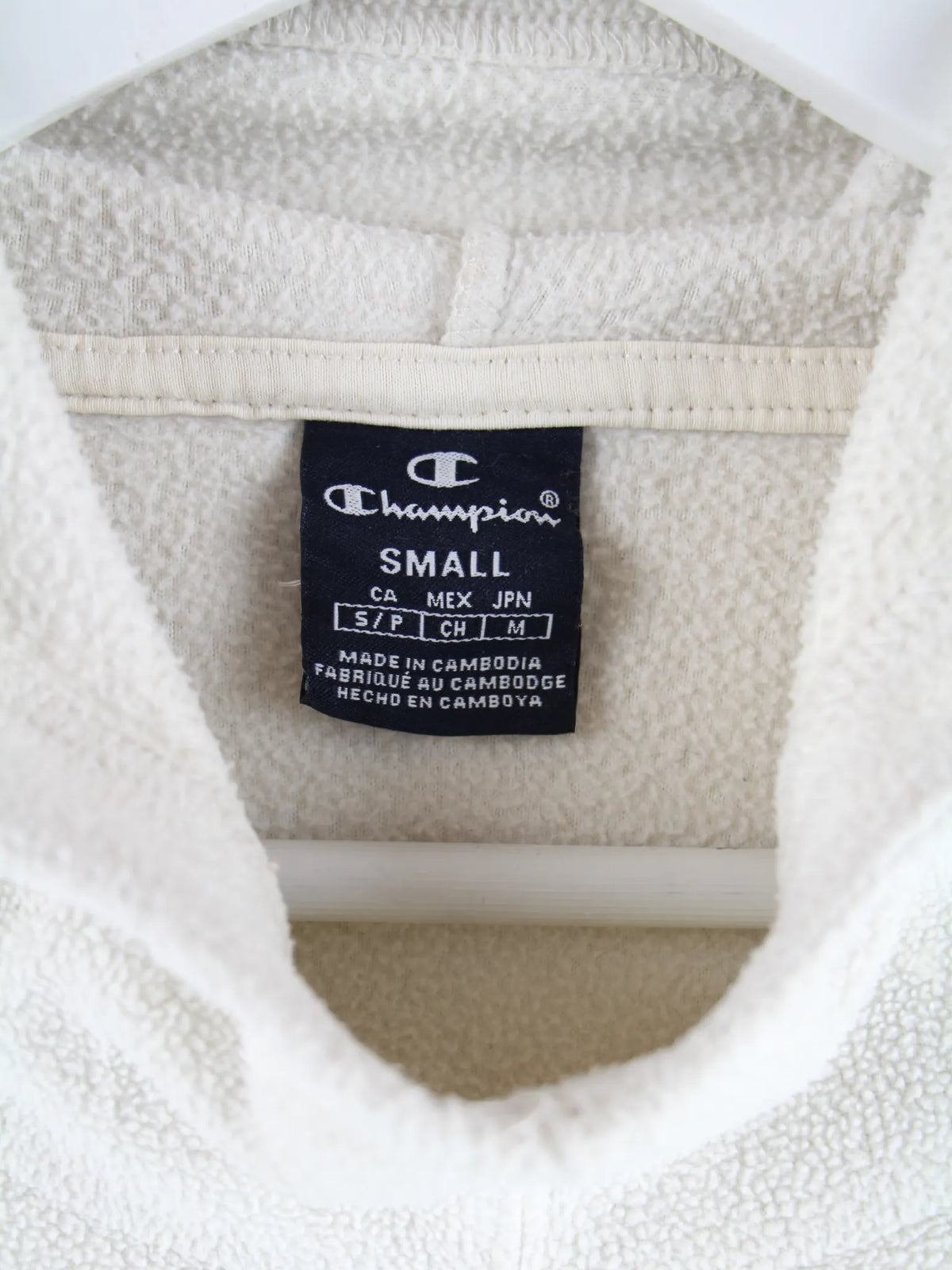 Champion Fleece Weiß S – Etikett