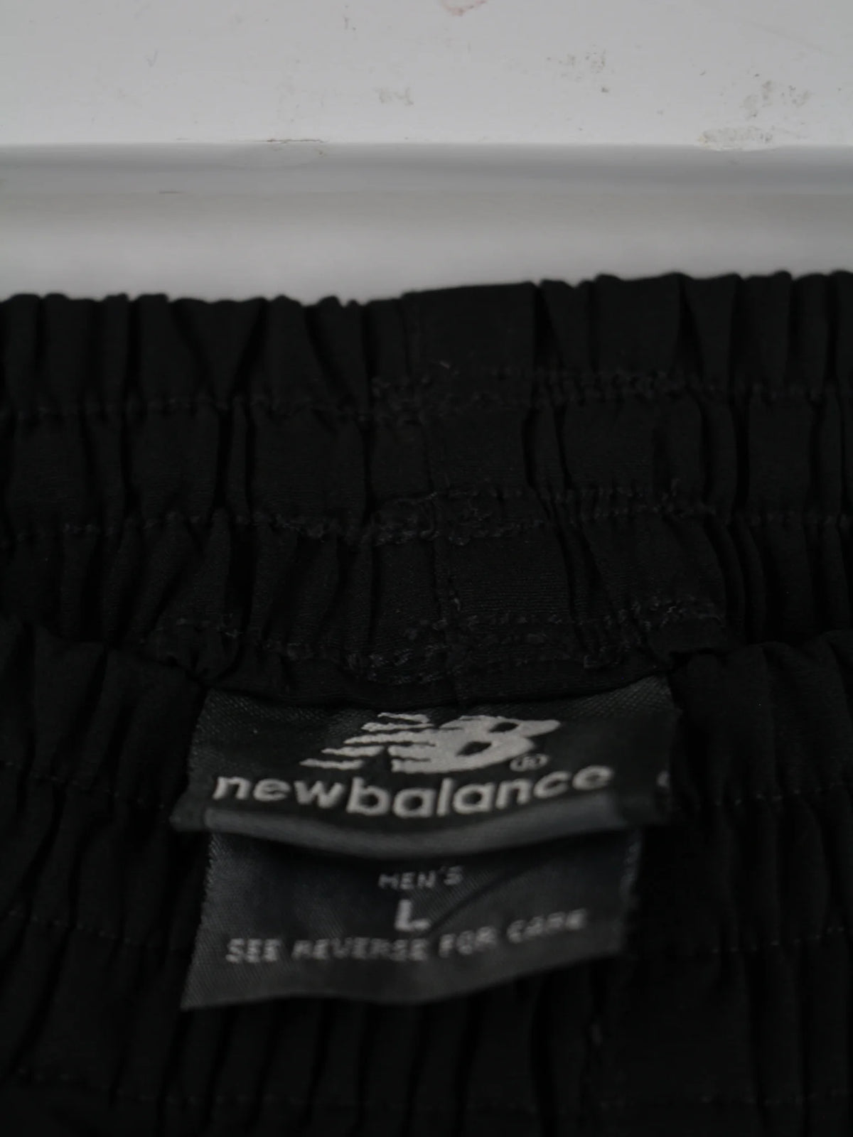 New Balance Track Pants Schwarz L – Etikett